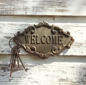 Welcome sign on wall.