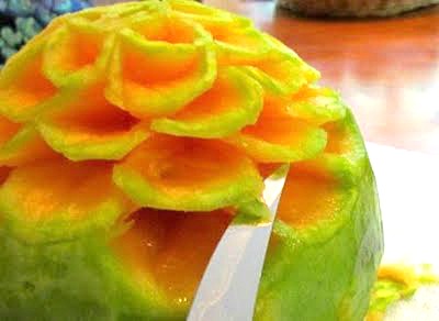 carving flower from cantaloupe
