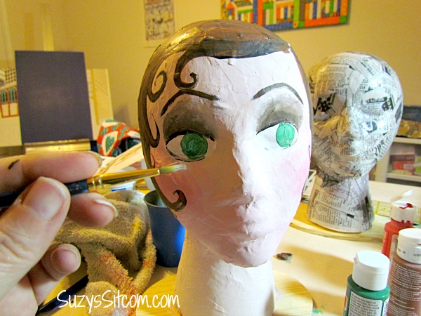 styrofoam head I painted --love the vintage hat on her (:)